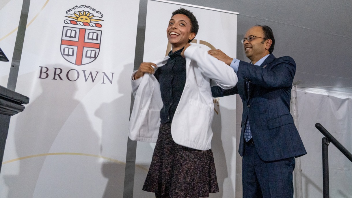 Brown’s new medical students don their white coats, taking their places